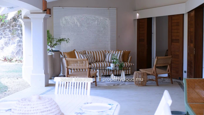 A home with a large garden that breathes elegance.