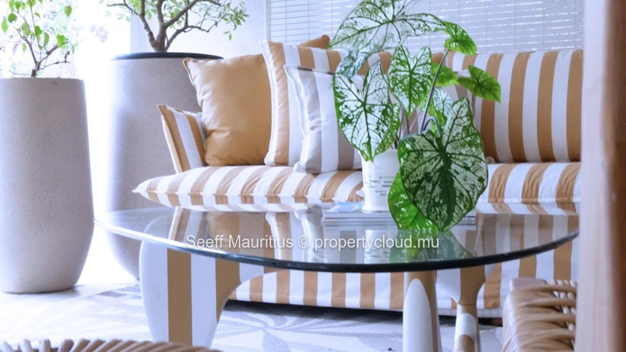 A home with a large garden that breathes elegance.