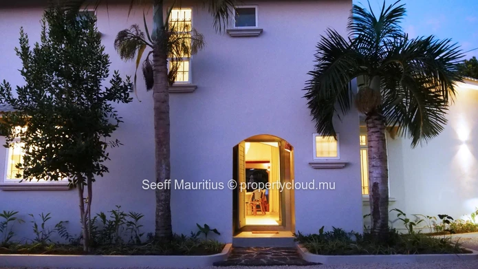 A home with a large garden that breathes elegance.