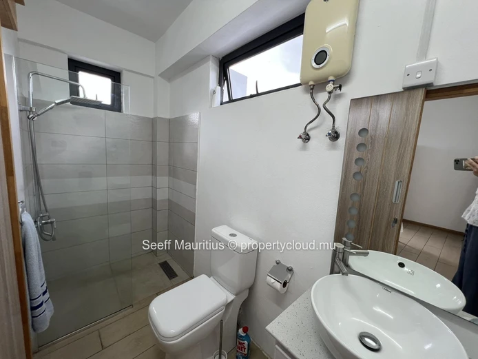 Modern 2-Bedroom Coastal Retreat with Panoramic Rooftop Pool