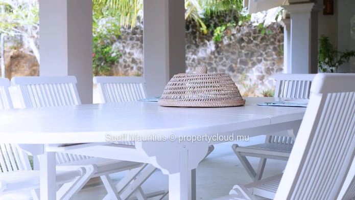 A home with a large garden that breathes elegance.