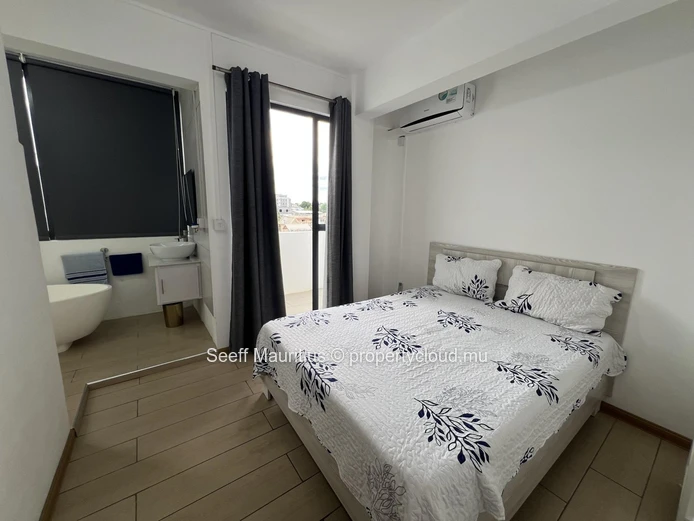 Modern 2-Bedroom Coastal Retreat with Panoramic Rooftop Pool